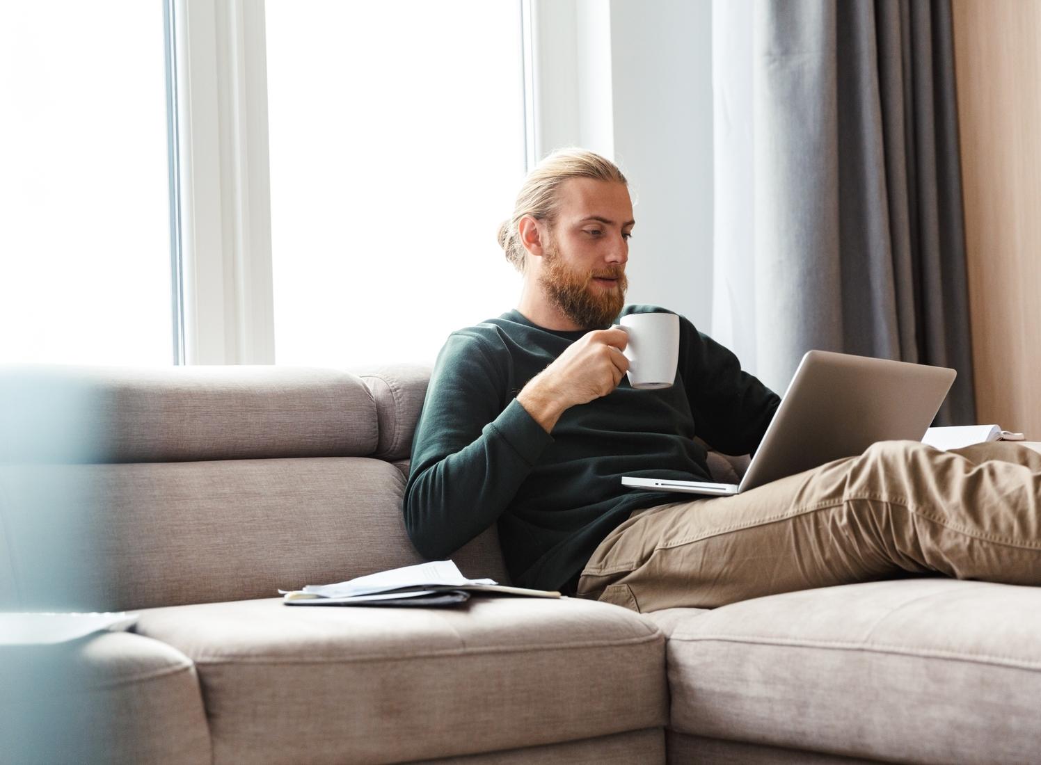 Man at computer on the couch