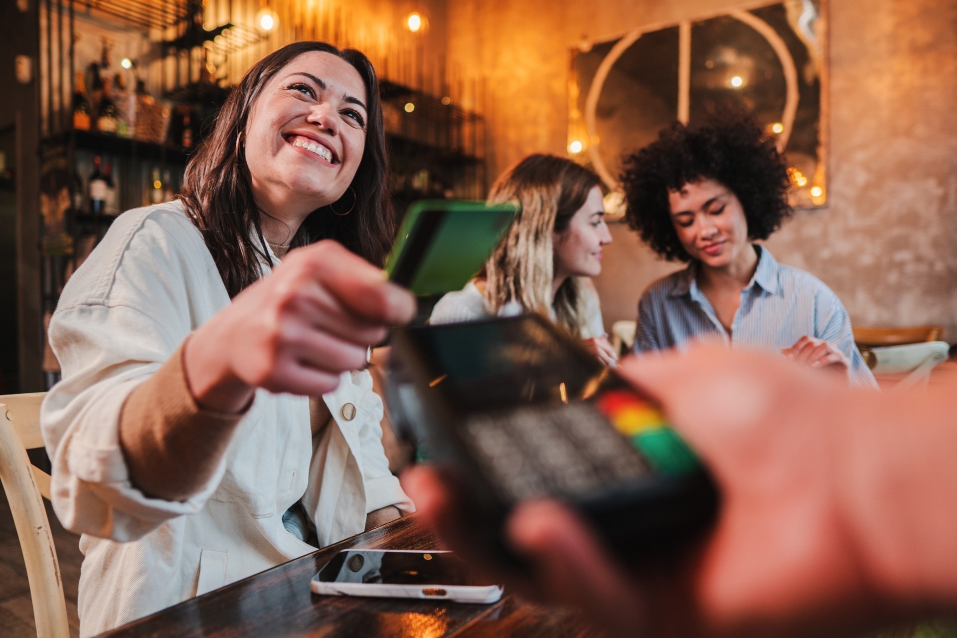 Woman using debit card