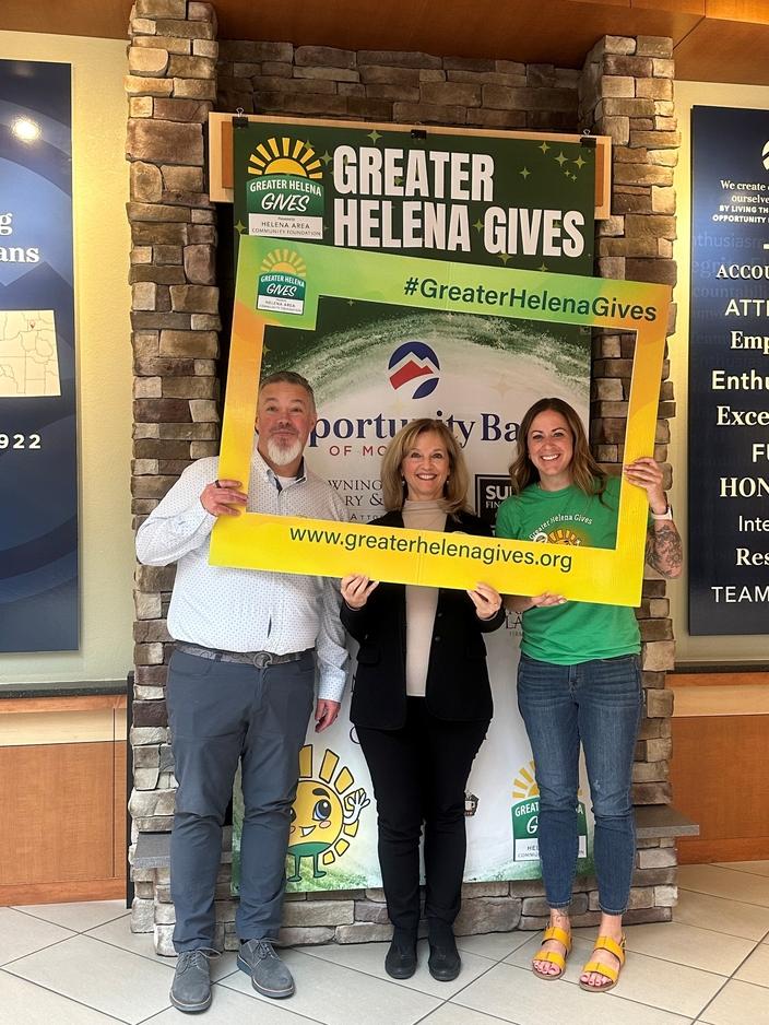 Jalena Johnson, at right, poses with Opportunity Bank President and CEO Laura Clark, center, and Business Development Officer Mark O&rsquo;Neill, to celebrate Greater Helena Gives in 2025. 